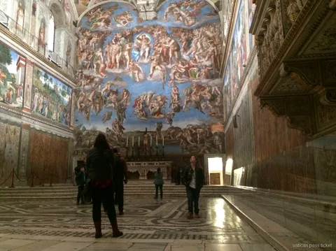 Vatican pass ticket visitors in the Sistine Chapel looking up at Michelangelo's Last Judgment fresco