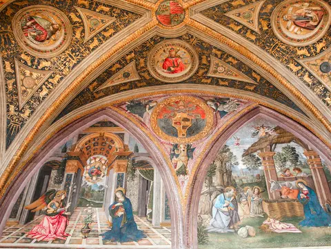 Gilded vaulted ceiling with Renaissance frescoes of the Annunciation and Nativity, seen on a Vatican pass ticket tour