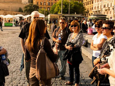 Small group meeting their guide on a cobbled square in Rome before the Vatican pass ticket tour starts